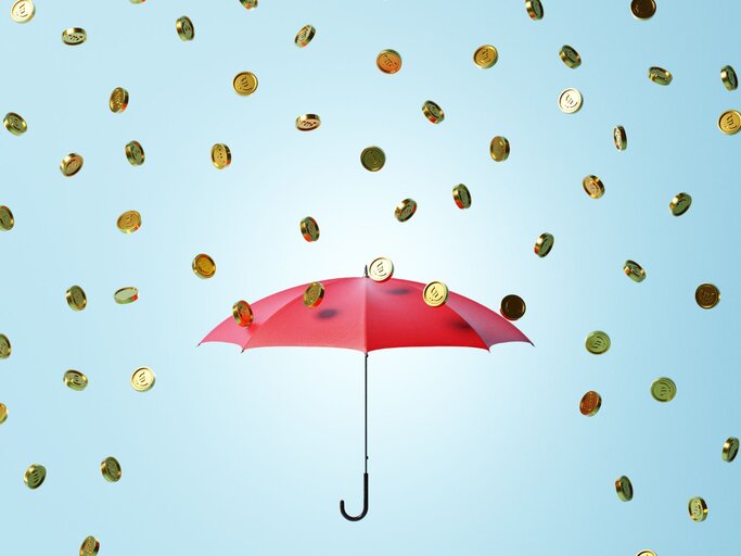 Illustration Regenschirm und Münzregen | © Getty Images/J Studios