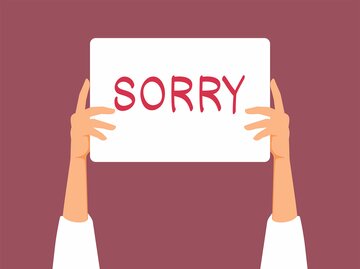 Grafik, auf der Hände ein Schild mit "sorry" hochhalten | © Getty Images/nicoletaionescu