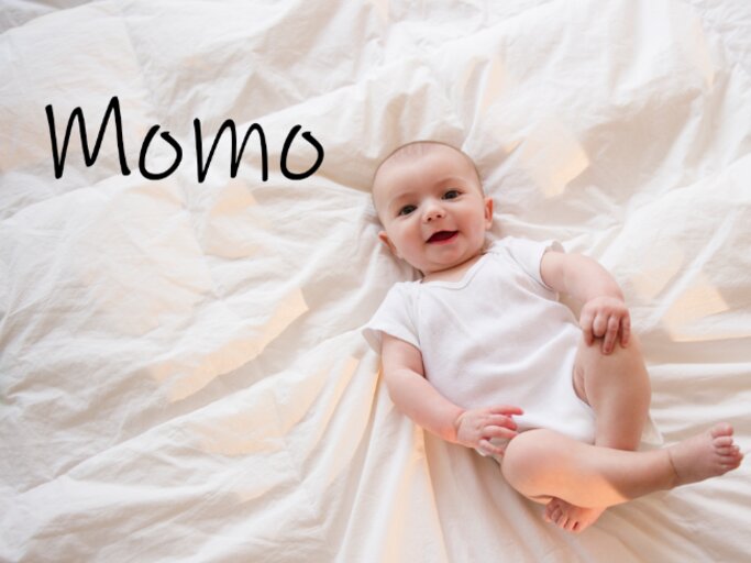 kleines süßes Baby mit dem Namen Momo | © Getty Images/Jamie Grill